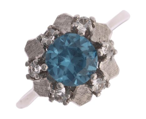 An 18ct white gold blue and white topaz flowerhead dress ring, setting height 10.7mm, size Q, 2.9gNo damage or repair, all st