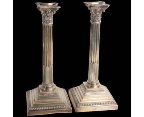 A pair of Edwardian silver Corinthian column table candlesticks, Walter Latham & Son, Sheffield 1909, loaded bases, 30cm, 76o
