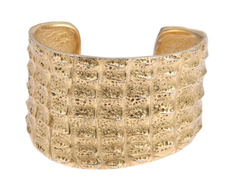 YVES SAINT LAURENT - a Vintage gilt-metal crocodile cuff bangle, signed YSL, setting height 46.7mm, internal circumference ap