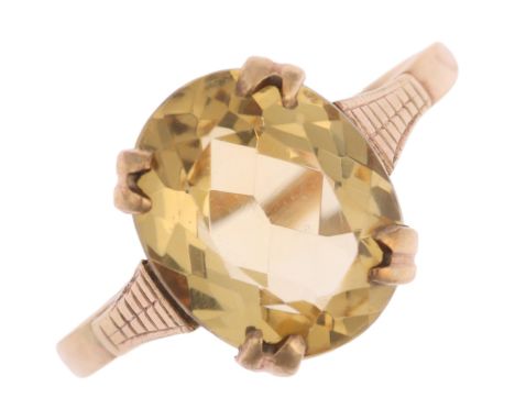 A mid-20th century 9ct gold citrine dress ring, set with oval mixed-cut citrine, setting height 11.1mm, size O, 2.3gNo damage