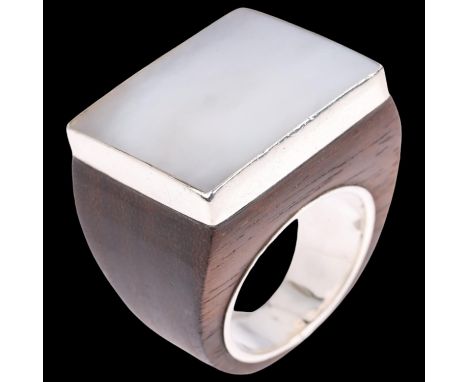 A large Danish sterling silver mother-of-pearl and hardwood signet ring, setting height 22mm, size S, 11.4gNo damage or repai