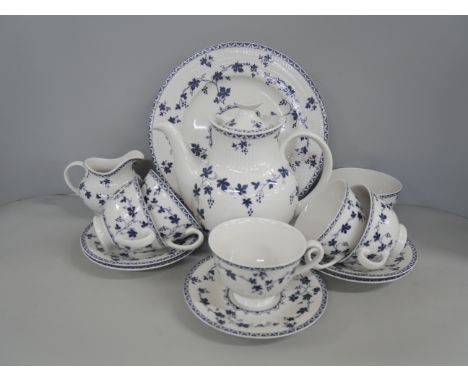 A Royal Doulton porcelain tea service in blue and white York Town pattern. Comprising of five teacups, five saucers, six side