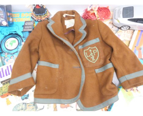 A selection of children's items including annuals, Beano, etc., school blazer, Aston Martin die-cast car, six dolls, fire eng