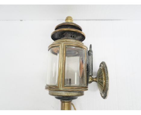 A Victorian brass coach lamp and wall bracket, converted to electricity **PLEASE NOTE THIS LOT IS NOT ELIGIBLE FOR IN-HOUSE P