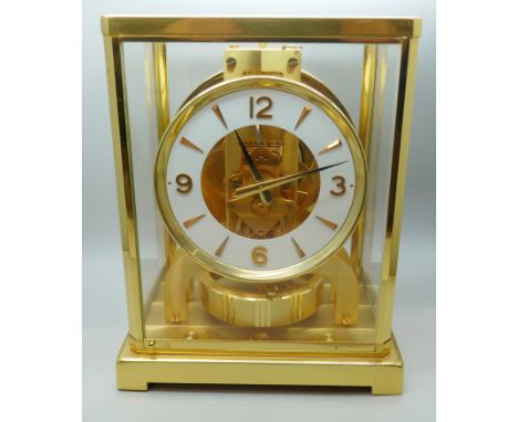 A Jaeger-LeCoultre Atmos clock, with fitted case, with Garrard &amp; Co. guarantee dated 1976, also with instruction manual m