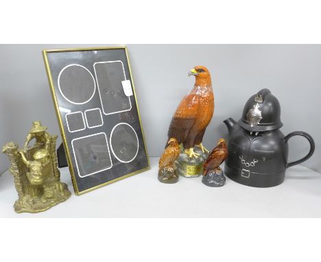 A Beswick Beneagles whisky decanter with contents, two similar small empty decanters, a novelty Carlton Ware policeman tea po