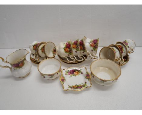 A collection of Royal Albert Old porcelain in Old Country Roses pattern including tea cups, coffee cups, saucers, sugar bowl,