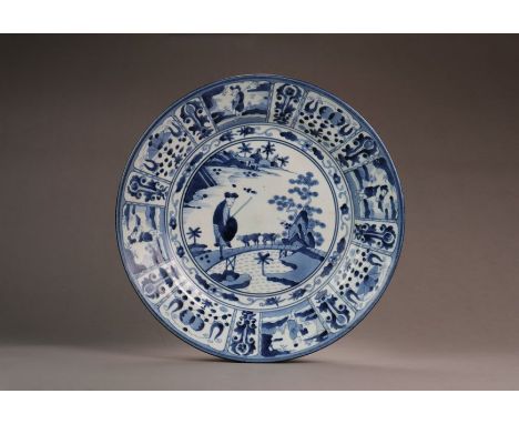 A Japanese Arita blue and white 'Kraak' style dishMeiji periodOf shallow form, the well painted in the Chinese Kraak style wi
