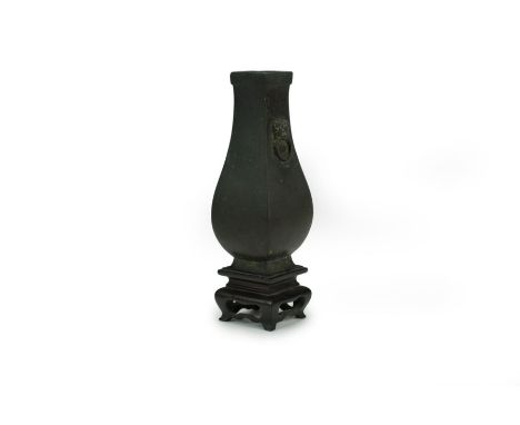 A small Chinese bronze vase, Hu Qing Dynasty Of square section with everted rim and twin lion-head and ring handles, with car