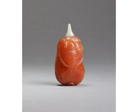 A Chinese agate and jade 'finger citron' snuff bottle Qing Dynasty The reddish-amber coloured stone with subtle banding well 