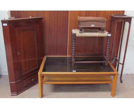 A 20th century mahogany hanging corner cupboard together with a teak coffee table with a smoked glass top, an oak bobbin turn
