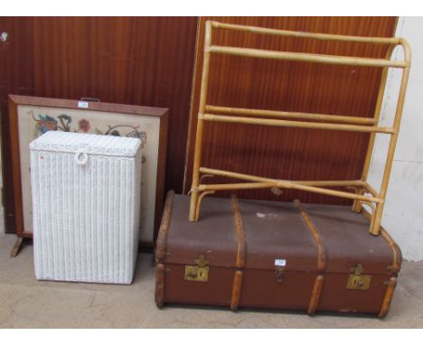 An oak framed woolwork decorated fire screen together with a loom laundry basket, a towel rail and a banded trunk, 
