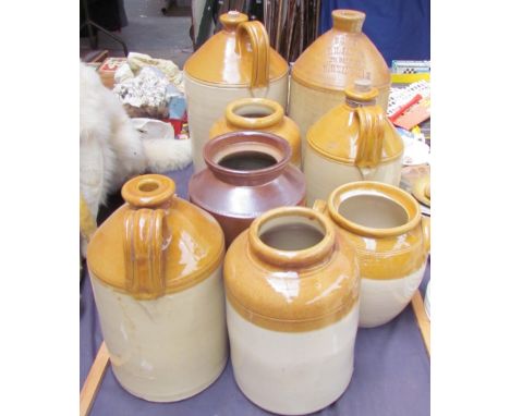 A stoneware flask for E.H. James together with a collection of stoneware storage jars and jugs