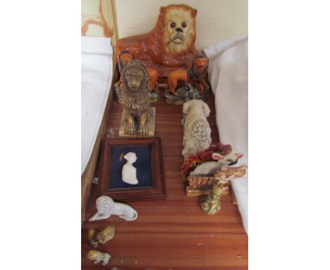 A Staffordshire pottery lion together with other model lions, portrait miniature etc 