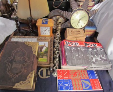 A leather bound copy of the Holy Bible together with POP Weekly magazines, mantle clocks, ships lamp, oak candlesticks, brass