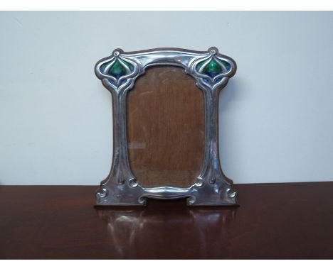 An Art Nouveau silver and enamel photograph frame (William Hutton & Sons, London 1903), 25cm high, it has a registered design