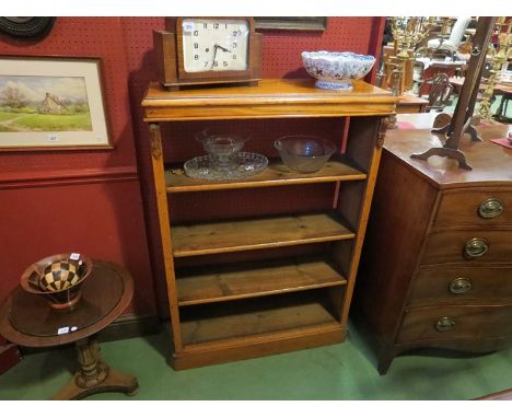 A Victorian oak four tier open book shelf 