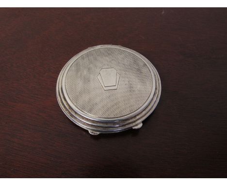 A Lady's silver compact, Birmingham 1939, deco form, 6.5cm diameter