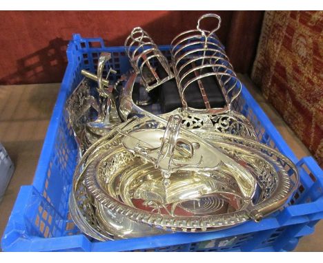 A quantity of plated ware including toast racks, mustard, berry spoons, over head swing handle baskets, silver spoon etc