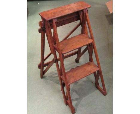 A pine three rung folding step ladder