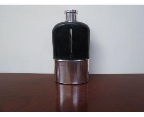 A large silver and leather hip flask (Thomas Johonson II, London 1884), 22.5cm high, removable silver cup which is gilt insid