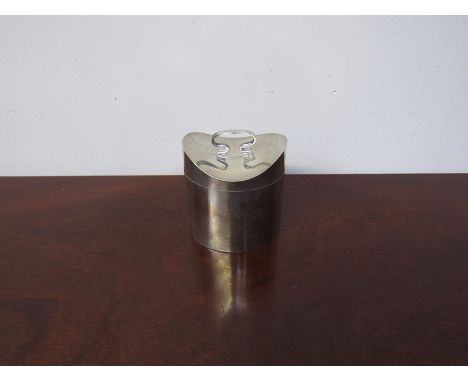 A William Neale silver lidded trinket box of hat box form with swing handle, Chester 1908, 8.5cm tall