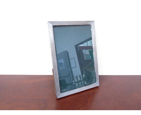A silver engine turned rectangular photo frame, Goldsmiths and Silversmiths company, 25cm x 17cm, London 1932