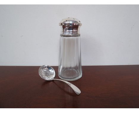 A silver lidded sugar castor and Francis & Howard silver sifting spoon, Sheffield 1967