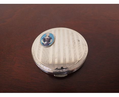 A silver compact with engine turned detail, later oval porcelain set plaque depicting a 1960's female, London 1964, 7cm diame