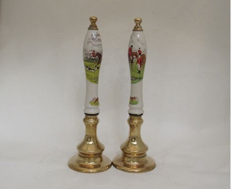 Two ceramic "hunting scene" beer pump handles with brass base