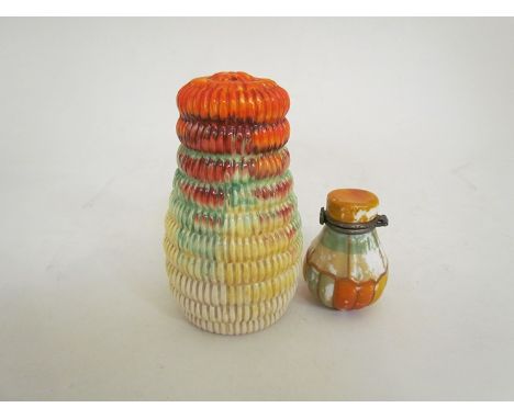 A Newport Pottery sugar sifter of ridged form possibly Clarice Cliff and a ceramic scent bottle 