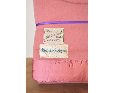 Two antique Marshall &amp; Snellgrove lap blankets, in rose pink 'All Pure Merino Wool', with 3' wide satin borders, labels r