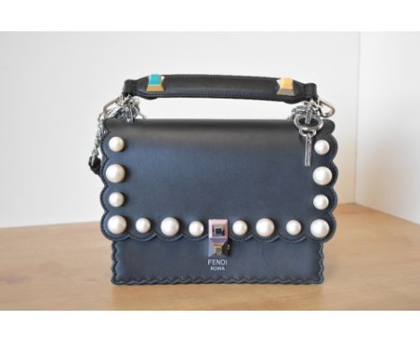 A Fendi Kan handbag in black leather with scalloped edge and plastic oversize pearl detail. pastel and gold stud hardware, a 