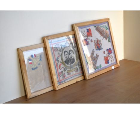 Three framed 20th century handkerchiefs. A 'Souvenir de France' white mesh / lace handkerchief with embroidered edging, havin