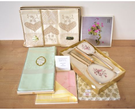 Four boxes containing vintage linens and home accessories, comprising a Northern Irish made tablecloth in mint green rayon, 5