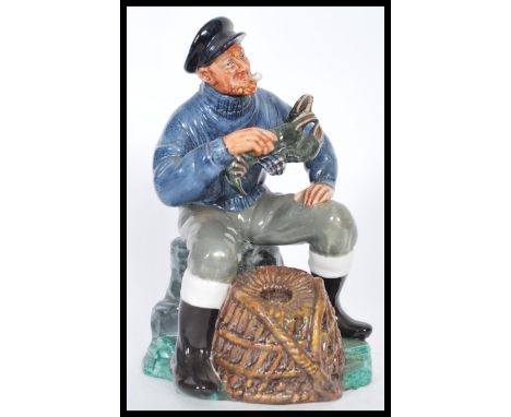 A Royal Doulton ceramic figurine entitled The Lobster Man HN2317 modelled on a naturalistic base with basket holding a lobste