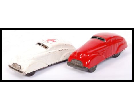 A pair of vintage likely Chad Valley made tinplate friction powered ' Siren ' cars. Comprising Ambulance and Fire Car. Red an