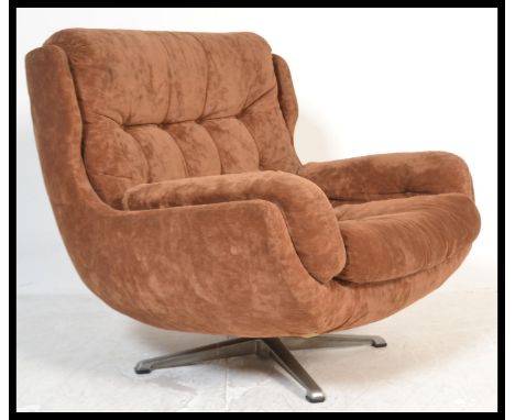 A stunning vintage retro original swivel egg chair / lounge chair by Englender, raised on a four crome splayed footed base, b