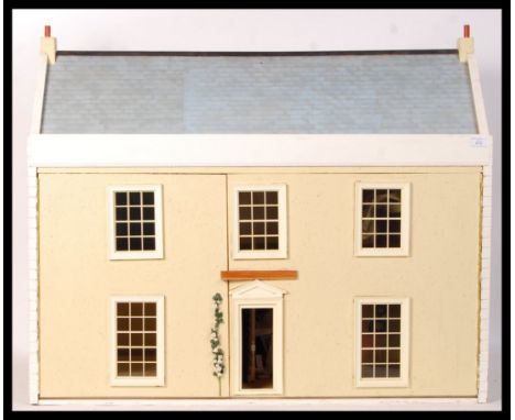A good 20th century vintage dolls house, with contents. Large Victorian style house with five rooms (including hallway). Come