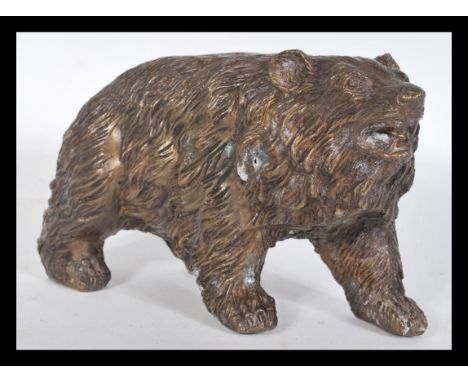 A good quality 20th century bronze figurine of a bear in the Black Forest taste having detailed features.&nbsp;