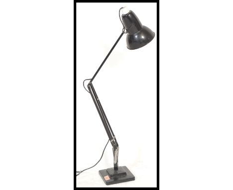 A vintage retro 20th Century Industrial Herbert Terry Anglepoise desk lamp raised on stepped square base with conical pendant