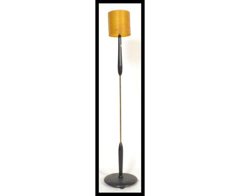 A vintage retro 20th century brass standard lamp raised on a circular base with central column and spun shade atop. Measures 