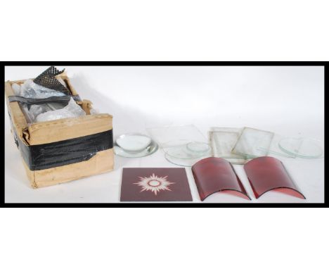 A collection of Victorian and later coaching carriage lamp spare glass plates to include concave cranberry glass example, red