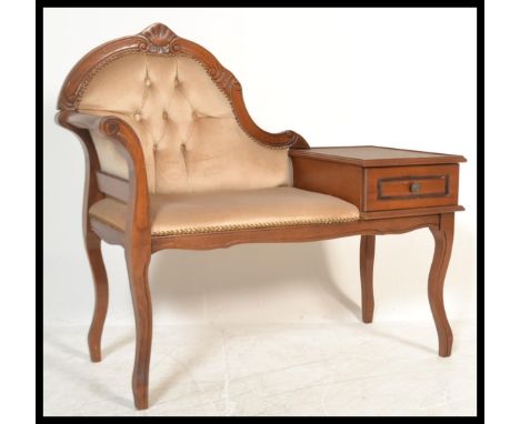 A 20th Century Louis style button back upholstered telephone seat, the fruitwood frame have a scroll back, single drawer and 