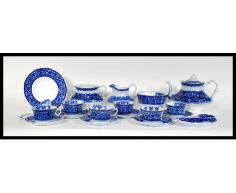 A 19th Century Victorian Staffordshire Flow Blue tea service consisting of teapot, cups, saucers etc. Stamped to base. Measur