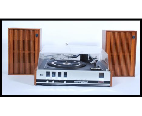 A retro 20th Century Phillips teak cased record player having a smoked acrylic top three speed deck with matching speakers. S