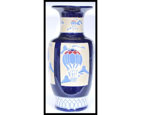 An early 20th Century 1930's Art Deco tall ceramic vase by Braham in the Balloon pattern having tube-lined decoration of hot 