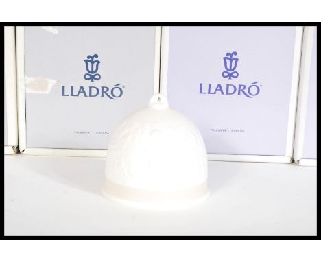 A set of eight Lladro ceramic bells complete in original boxes to include 7613 Spring, 7614 Summer, 17614 Summer, 17615 Fall,