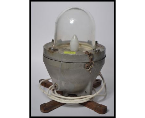 A vintage 20th Century&nbsp;industrial bulkhead light, converted into a table lamp. dome shaped bomb blast&nbsp; glass shade 