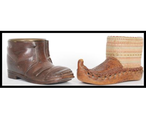 An early 20th Century black forest wooden treen item in the form of a shoe having a brass tobacco bowl inserted to the top al